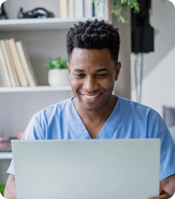 Healthcare provider working on a laptop